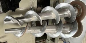 Welded screw conveyor auger flight shaft with multiple helical flights assembled for industrial use