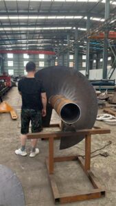 Large diameter hollow screw conveyor shaft with variable pitch screw flight