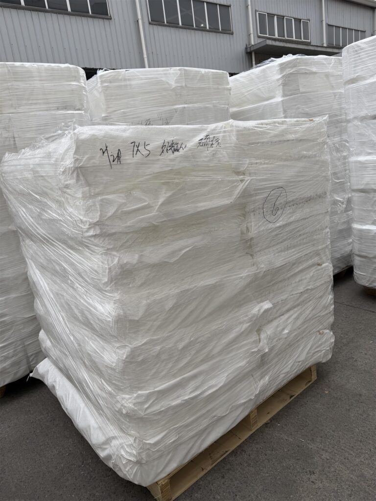 Elevator buckets, bolts and belt clamps packed on pallet for a long-term customer shipment