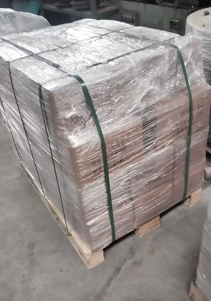 Long-term customer order including elevator buckets, bolts and belt clamps packed on pallets