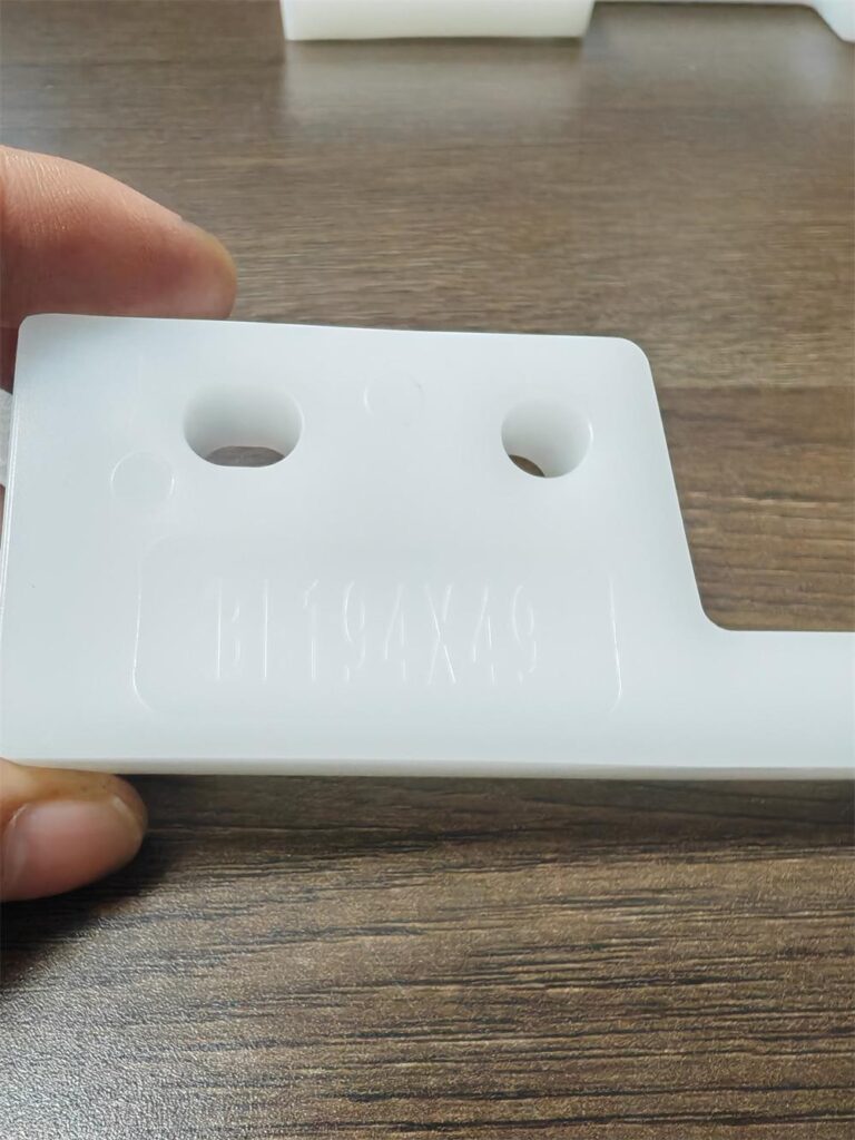 Model marking and mounting holes on a BF plastic conveyor flight