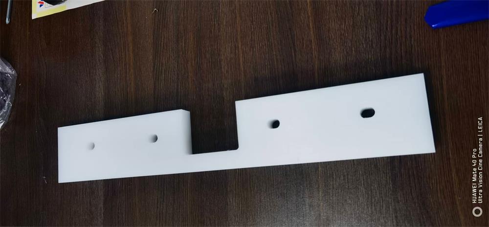 Custom UHMWPE BF460 × 75 × 20 conveyor flight with mounting holes