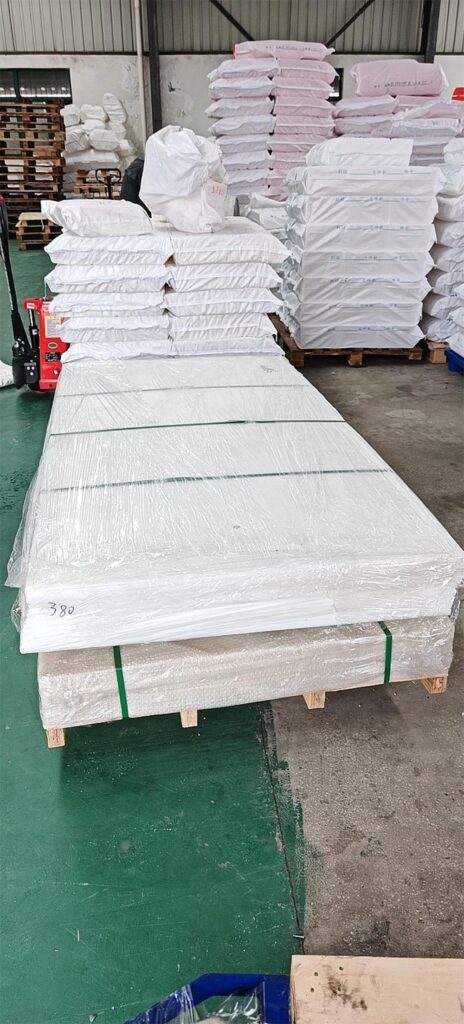 White PA6 nylon sheets stacked above pale yellow PA66 nylon sheets